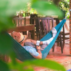 A local man resting in a hammock at a Mekong Delta village home along the cycling route