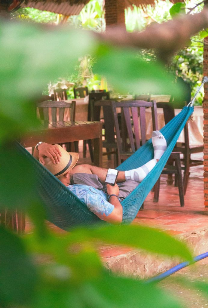 A local man resting in a hammock at a Mekong Delta village home along the cycling route
